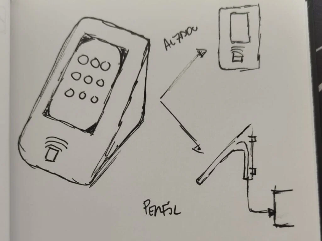 Bocetos a mano en una libreta del terminal de fichaje, en perspectiva y de perfil